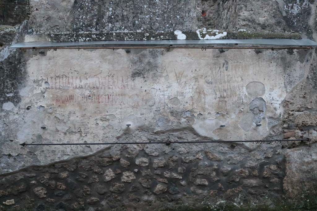 I.14.7/8 Pompeii. December 2018. Looking south towards graffiti between I.14.7 and I.14.8. Photo courtesy of Aude Durand.