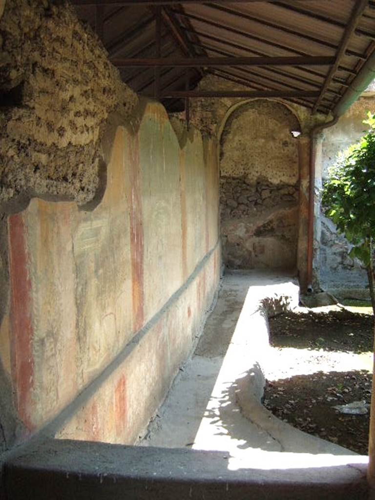 I.17.4 Pompeii. May 2006. Looking east along north wall of peristyle garden.
There are four painted panels each of which contains a garden painting.

