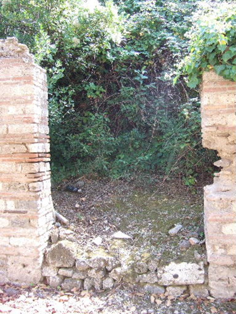 I.19.1 Pompeii. September 2005. Entrance doorway, looking south.
According to Hunink, graffito naming Actius was found on the counter of I.11.2 [=I.19.2]
<B=H>onus deus hic (h)abitat in do/mo / Act(i)      [CIL IV, 8417]
He translates this as A good god lives here in the house of Actius.
See Hunink, V., 2011. Glcklich ist dieser Ort!: 1000 Graffiti aus Pompeji. Stuttgart: Philipp Reclam, p. 60 no. 101.
