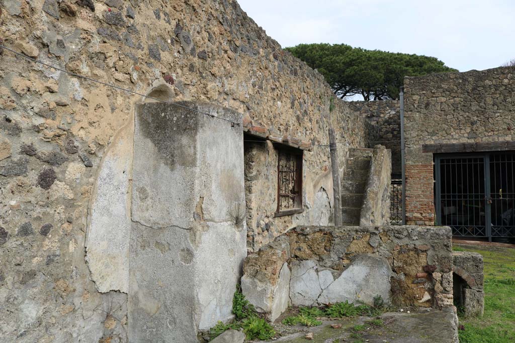 I.20.1 Pompeii. December 2018. 
Looking towards north-east corner, across triclinium towards stairs to upper floor, at rear. Photo courtesy of Aude Durand.
