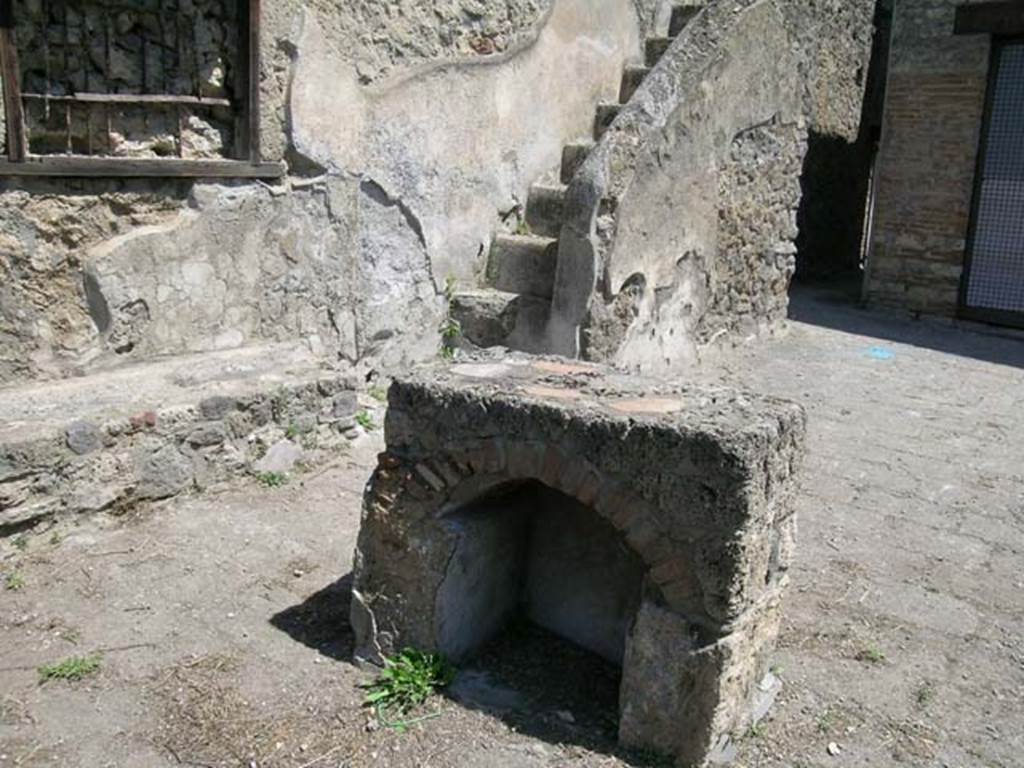 I.20.1 Pompeii. June 2005. Looking east towards feature, with stairs to upper floor, at rear. Photo courtesy of Nicolas Monteix.