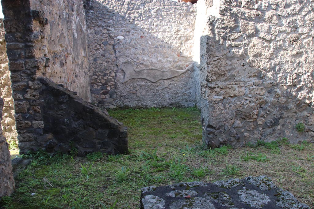 I.20.2 Pompeii October 2022. Looking towards rear room in south-west corner, and doorway to I.20.1. Photo courtesy of Klaus Heese.