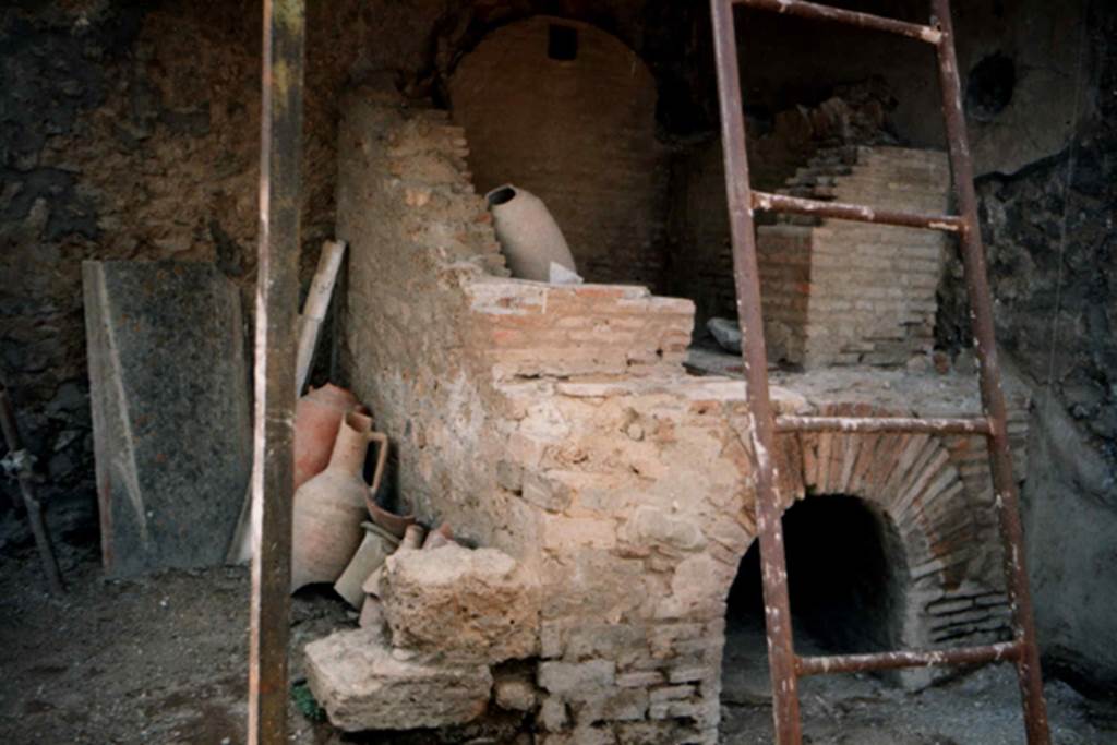 I.20.3 Pompeii. April 1987, oven in rear room during consolidation. Photo courtesy of Guy de la Bedoyere.
