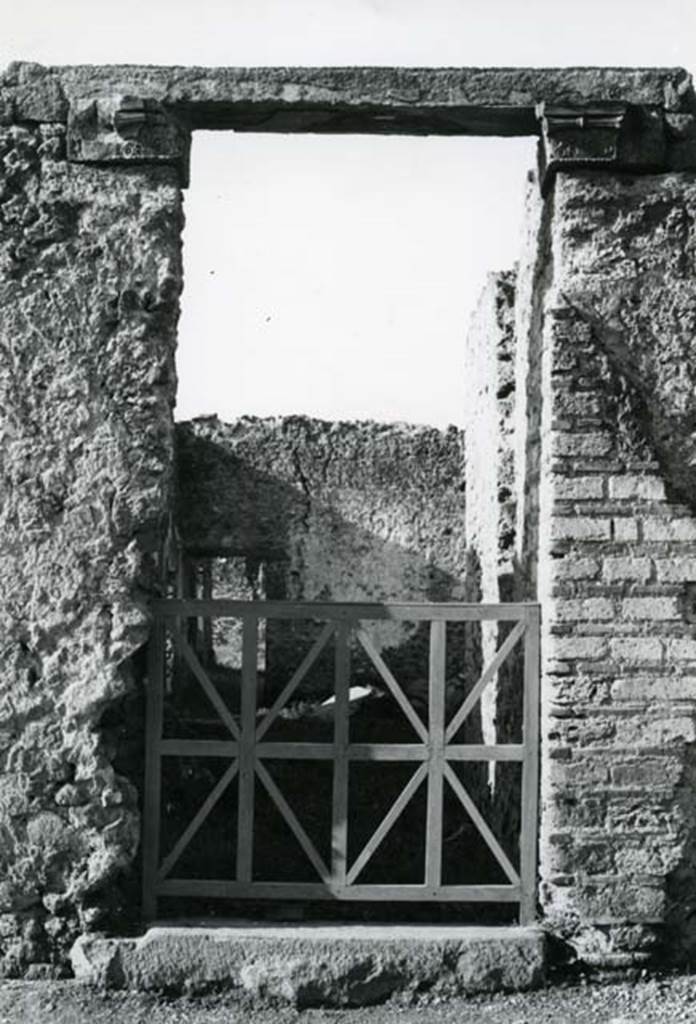 I.20.4 Pompeii. 1975. Shop House, entrance, pilaster capitals.  Photo courtesy of Anne Laidlaw.
American Academy in Rome, Photographic Archive. Laidlaw collection _P_75_7_23.
