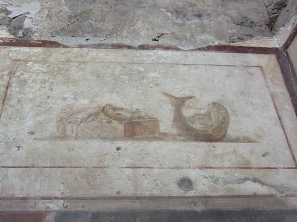 II.1.12 Pompeii. March 2009. Upper part of west wall of triclinium with wall painting of fishes.