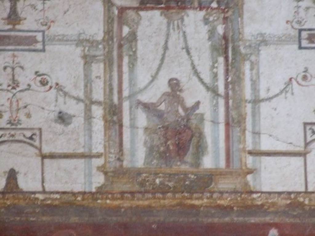 II.2.2 Pompeii. December 2006. Room “f”, detail of painting of seated figure on west wall.