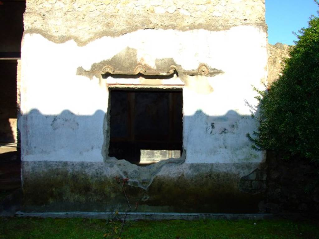 II.3.3 Pompeii. March 2009. Room 11, east side of garden area and exterior wall of room 10 with window.