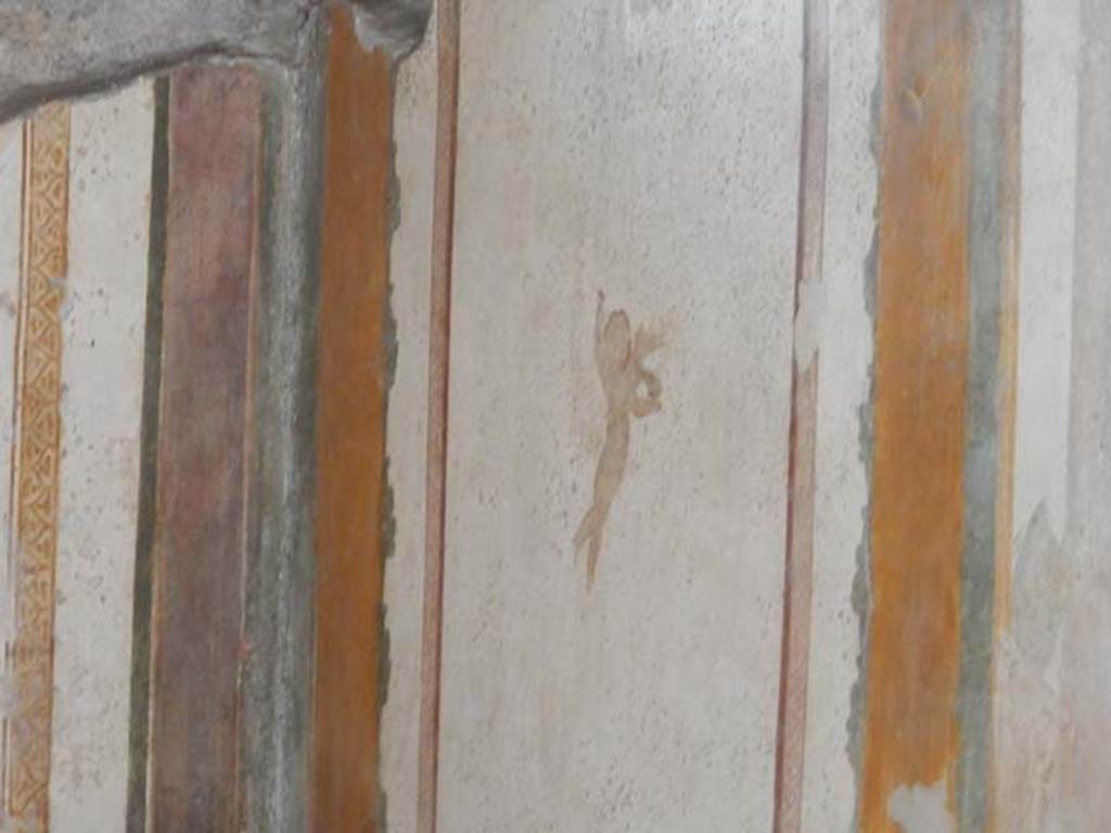 II.3.3 Pompeii. May 2016. Room 4, painted cupid from east end of south wall.
Photo courtesy of Buzz Ferebee
