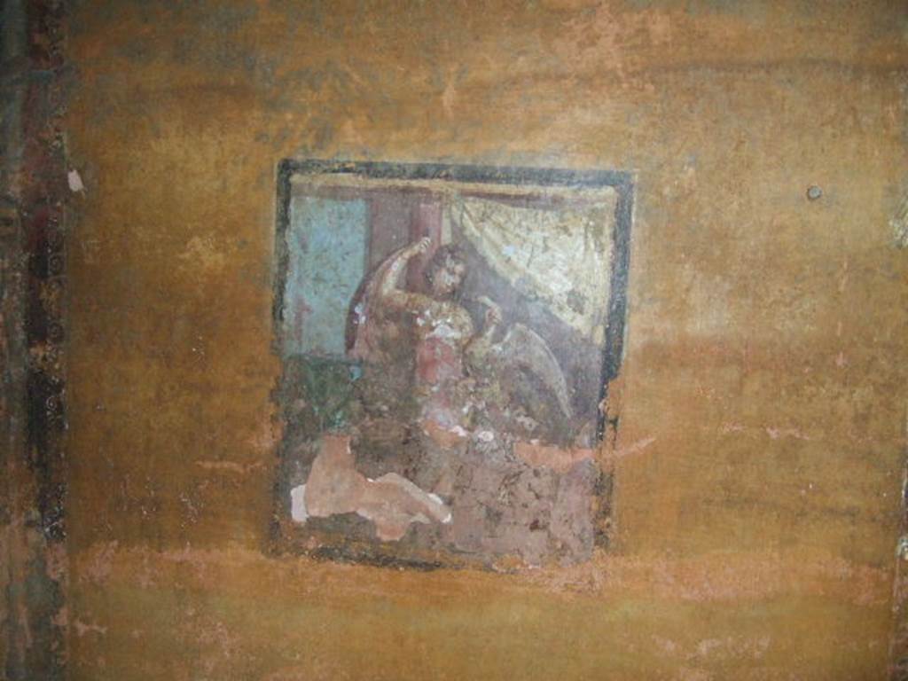 II.3.3 Pompeii. December 2006. Room 12, north wall of cubiculum with central panel of wall painting of Leda and the Swan.
