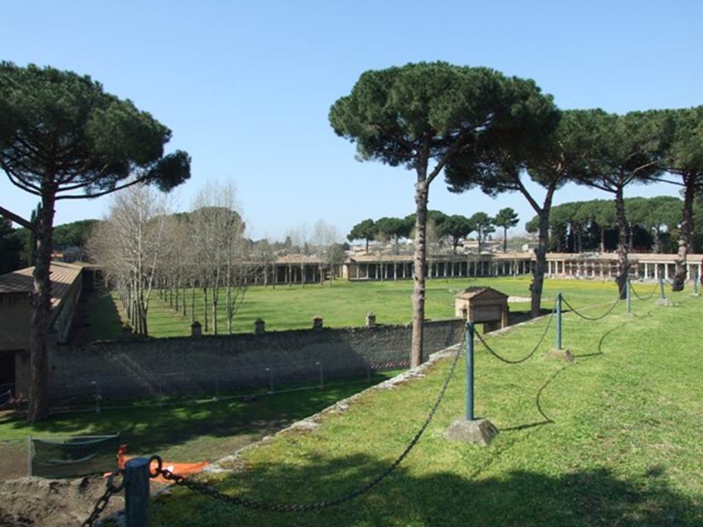 II.7.2 Pompeii. Palaestra. March 2009. Looking across between entrances II.7.1 and II.7.2 from top of amphitheatre.