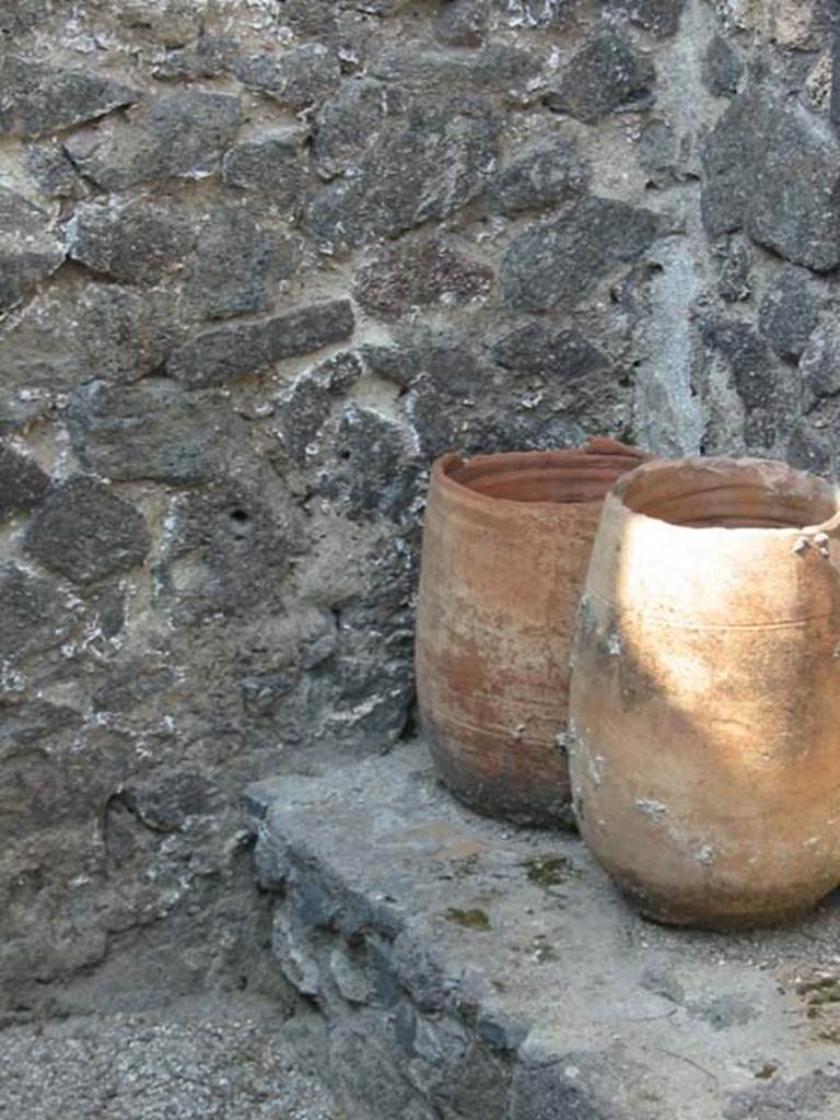 II.8.5 Pompeii. May 2003. Terracotta pots in third room on north side of corridor. Photo courtesy of Nicolas Monteix.