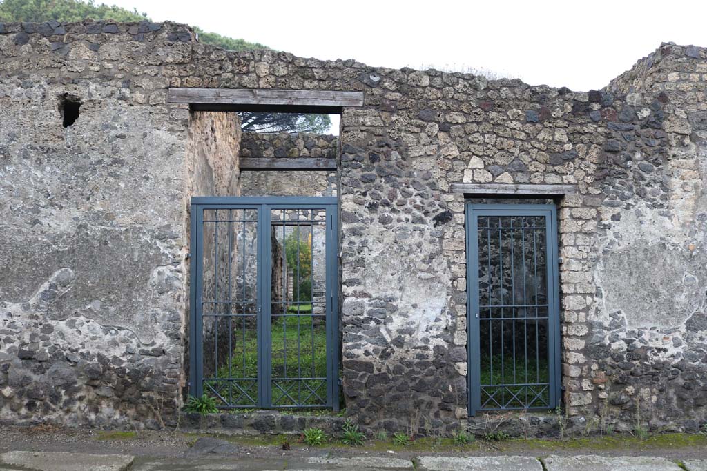 II.8.5 Pompeii, on left. December 2018. 
Looking east on Via di Nocera towards entrance doorways, with II.8.4, on right. Photo courtesy of Aude Durand.
