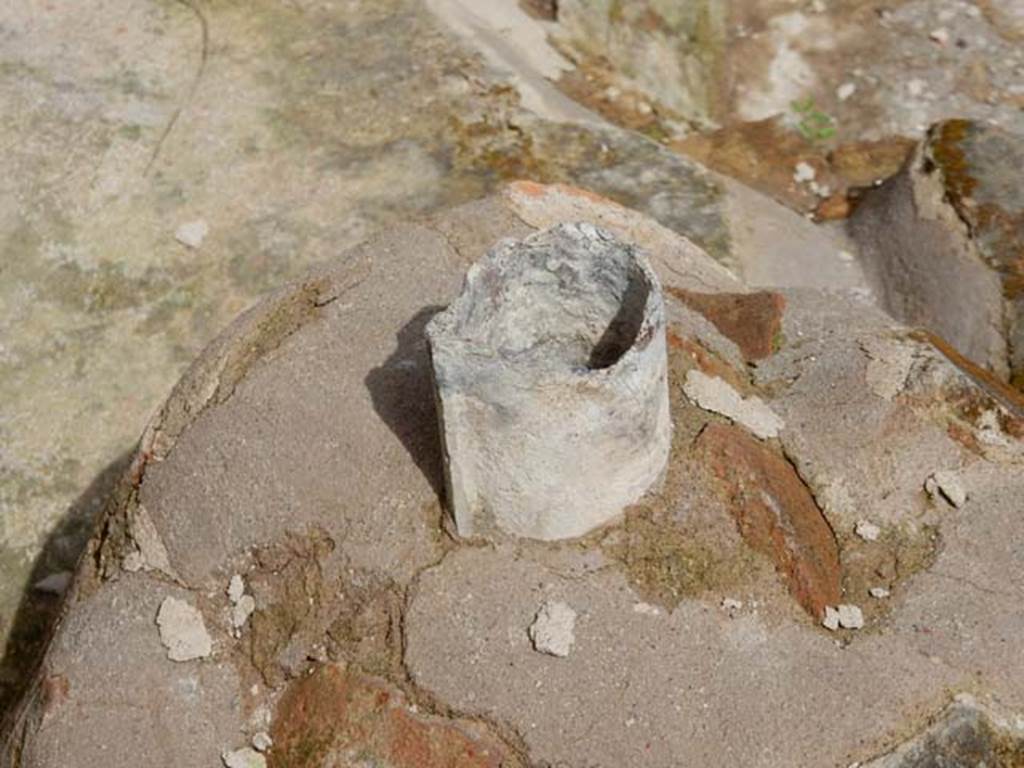 II.9.4, Pompeii. May 2018. Lead pipe from top of feature at south end of gutter. Photo courtesy of Buzz Ferebee. 