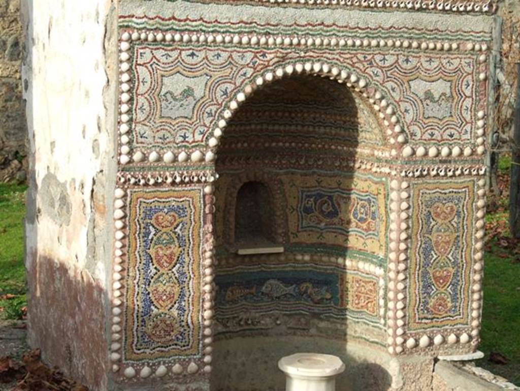II.9.7. Garden entrance to House of Summer Triclinium.  December 2007.  Front mosaic face of fountain on north side.