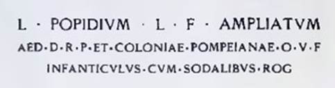 Inscription in red letters to LUCIUM POPIDIUM LUCI FILIUM AMPLIATUM.
The Epigraphik-Datenbank Clauss/Slaby (See www.manfredclauss.de) has

L(ucium) Popidium L(uci) f(ilium) Ampliatum / aed(ilem) d(ignum) r(ei) p(ublicae) coloniae Pompeianae o(ro) v(os) f(aciatis) / Infanticulus cum sodalibus rog(at)      [CIL IV, 7665]
