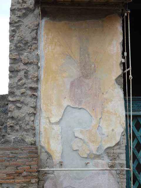III.3.6 Pompeii. April 2019. West entrance pillar display notice.
Drawings, from 1930, of the large military trophies that decorated the pillars at the entrance of the Schola.
Photo courtesy of Rick Bauer.
