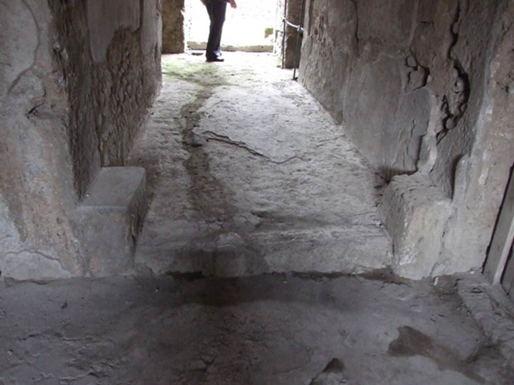 III.4.3  Pompeii.  March 2009.   Looking north at doorway and floor of Room 7 from room 8