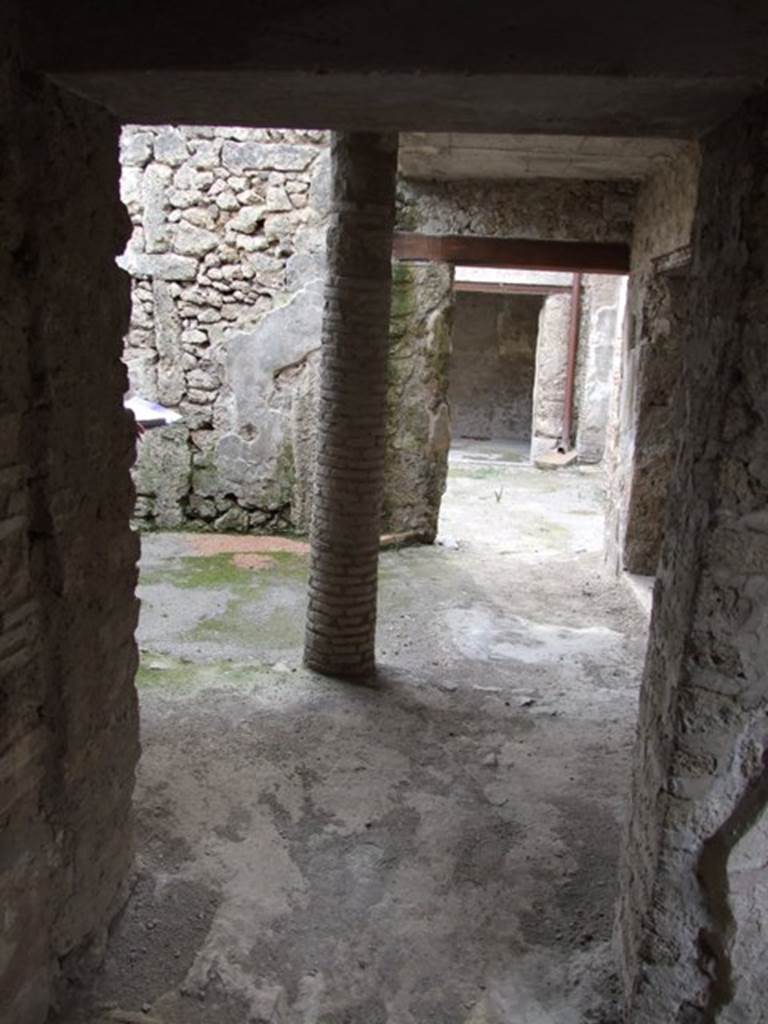 III.4.3  Pompeii.  March 2009.   Room 12.  Looking west, along north portico, also used as a passageway from the atrium of III.4.2 to the service rooms in III.4.3