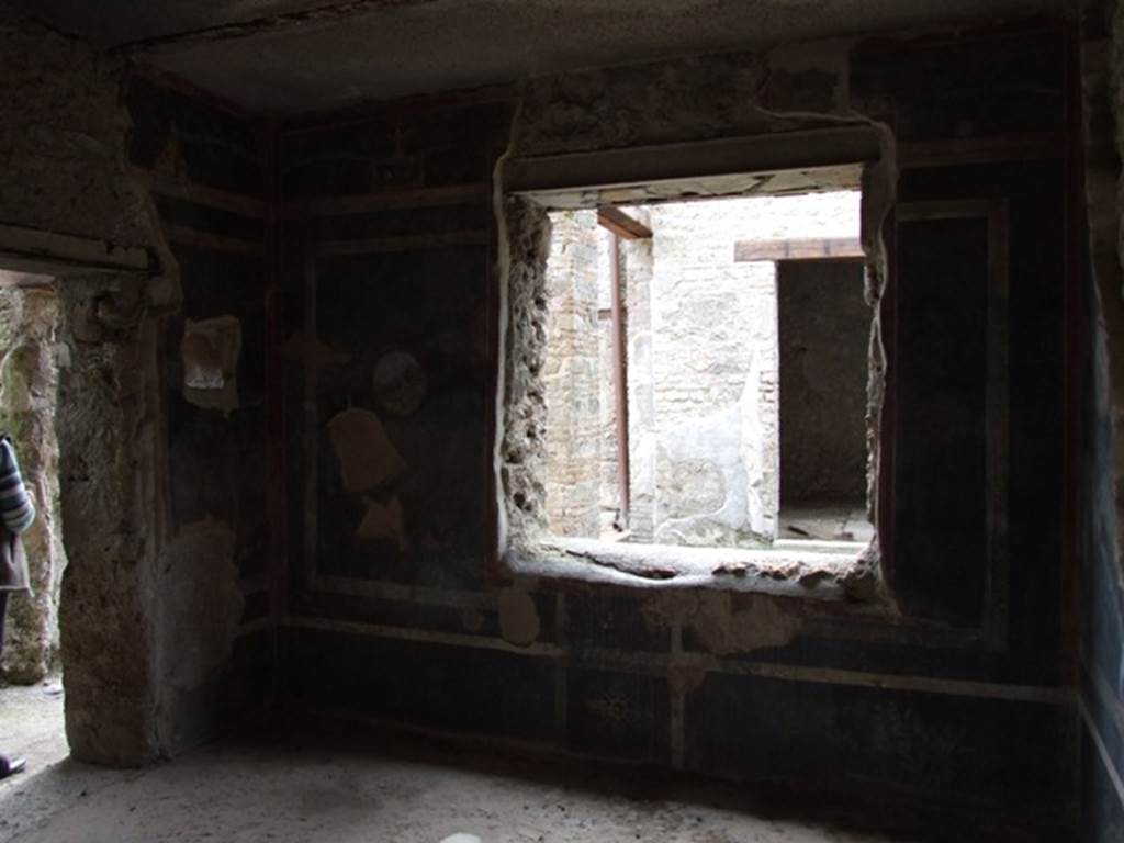 III.4.3  Pompeii.  March 2009.   Room 13.  West wall, with window overlooking garden Room 14. 