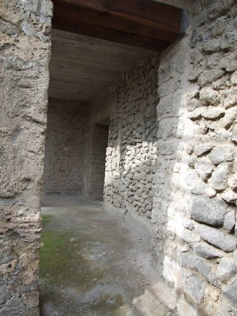 III.4.3  Pompeii.  March 2009.   Room 23. Looking north through doorway to east side of courtyard at room 12.