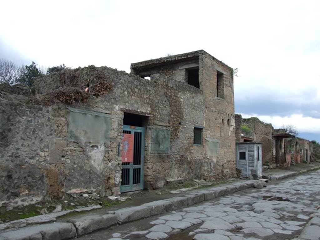 III.4.3 Pompeii. December 2006. House with upper floor. Looking east along Via dell’Abbondanza.