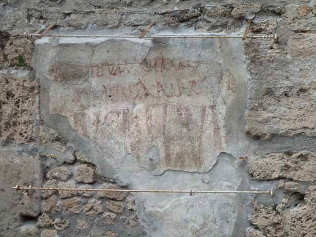 III.4.3 Pompeii. May 2010. Graffiti to west side of entrance doorway. Remains of CIL IV 7691 (partly conserved), and remains of CIL IV 7692, confused with another inscription unedited, reading LVCRETIVM on west side (left) of entrance doorway. See Varone, A. and Stefani, G., 2009. Titulorum Pictorum Pompeianorum, Rome: L’erma di Bretschneider, (p.264-5)  Beneath these would have been CIL IV 7694 and 7695, now fallen.

According to Epigraphik-Datenbank Clauss/Slaby (See www.manfredclauss.de) these read as –

A(ulum)  Suettium  Verum 
aed(ilem)  Hymenaeus  rog(at)  et  cupit      [CIL IV 7691]

L(ucium)  Popidium  Secundum 
aed(ilem)  v(iis)  aed(ibus)  s(acris)  p(ublicis!)  Epidius  Hymenaeus  r(ogat)      [CIL IV 7692] 

] 
Alipe  cupis      [CIL IV 7694]

Lucretium 
Valentem  fil(i)um  aed(ilem)       [CIL IV 7695] 

