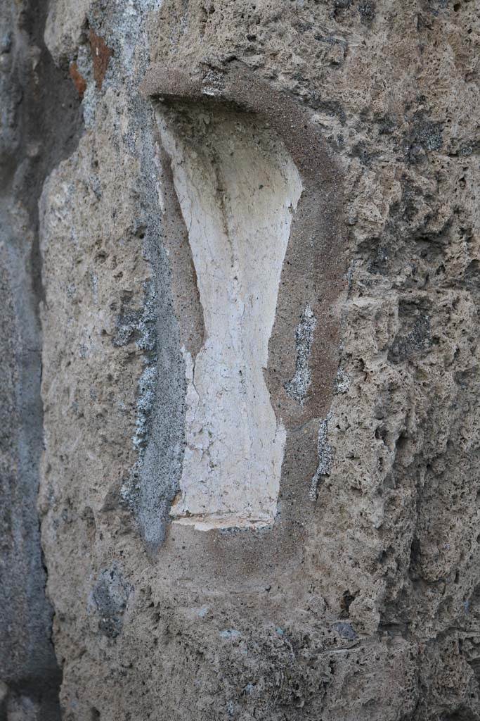 V.2.3 Pompeii. December 2018. 
East side of staircase, detail of remains of plaster. Photo courtesy of Aude Durand.
