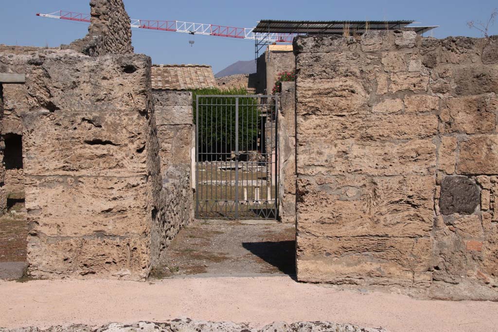 V.2.4, Pompeii. September 2021. Looking north on Via di Nola towards entrance doorway.  Photo courtesy of Klaus Heese.
