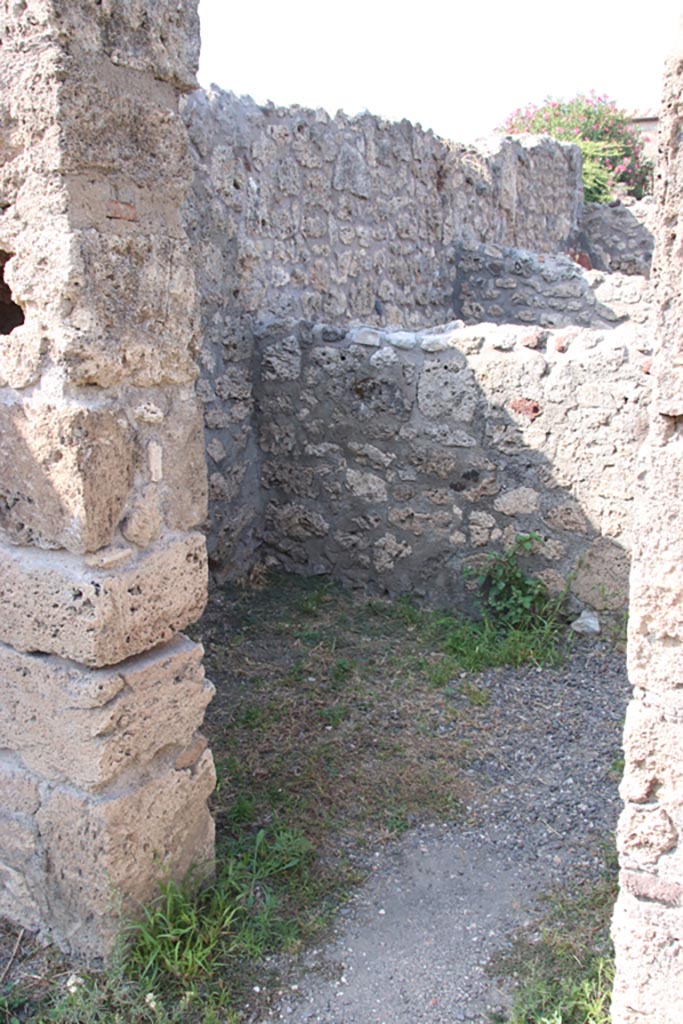 V.2.6 Pompeii. October 2023. 
Doorway in north wall of shop-room, into rear room. Photo courtesy of Klaus Heese.
