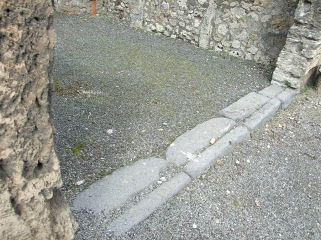 V.2.8 Pompeii. March 2009. Sill or threshold of entrance doorway into shop.

