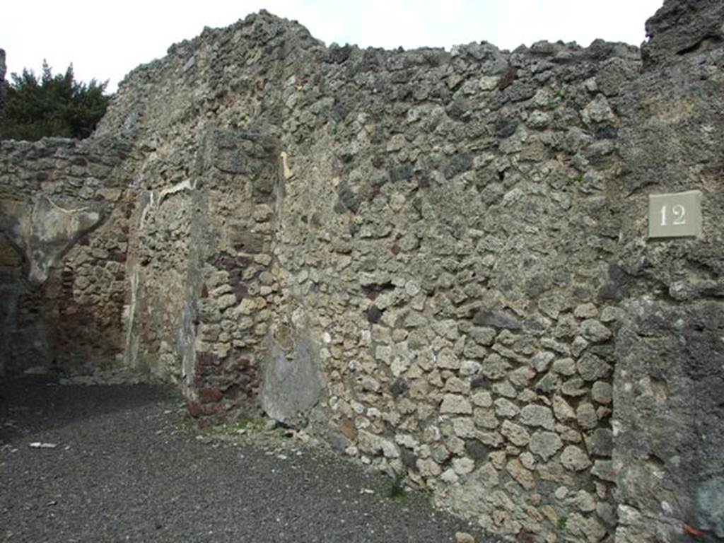V.2.12 Pompeii.  March 2009.  East wall of shop, with doorway to rear room and site of stairs to upper floor.