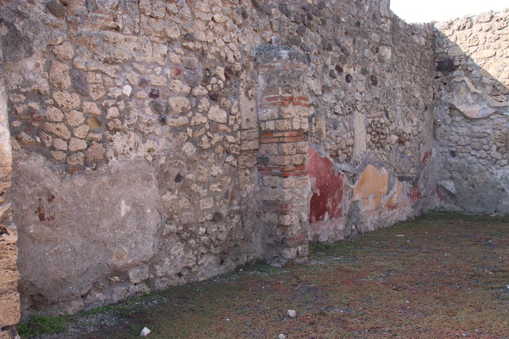 V.2.14 Pompeii. October 2022. West wall of shop, and west wall of rear room, on right. Photo courtesy of Klaus Heese.