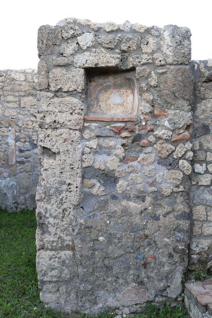 V.2.14 Pompeii. December 2018. 
Pilaster with niche Lararium in north wall of shop. Photo courtesy of Aude Durand.
