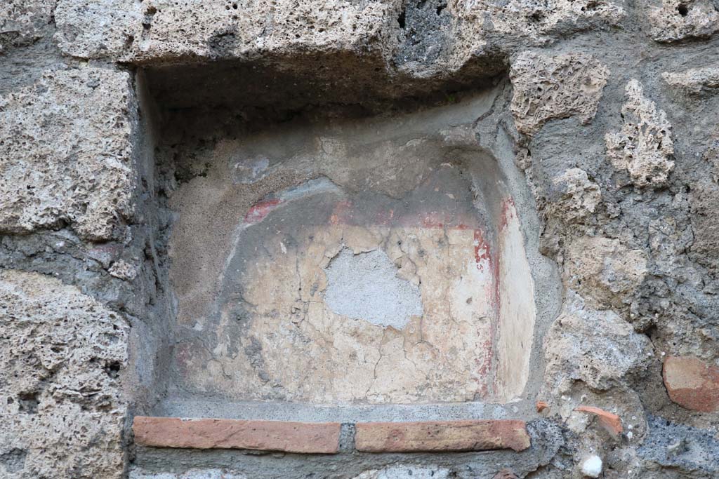 V.2.14 Pompeii. December 2018. Niche Lararium in north wall of shop. Photo courtesy of Aude Durand.