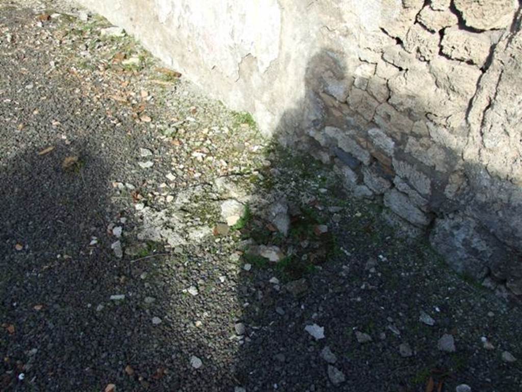 V.2.15 Pompeii.  December 2007. Remains of base of staircase against east wall.