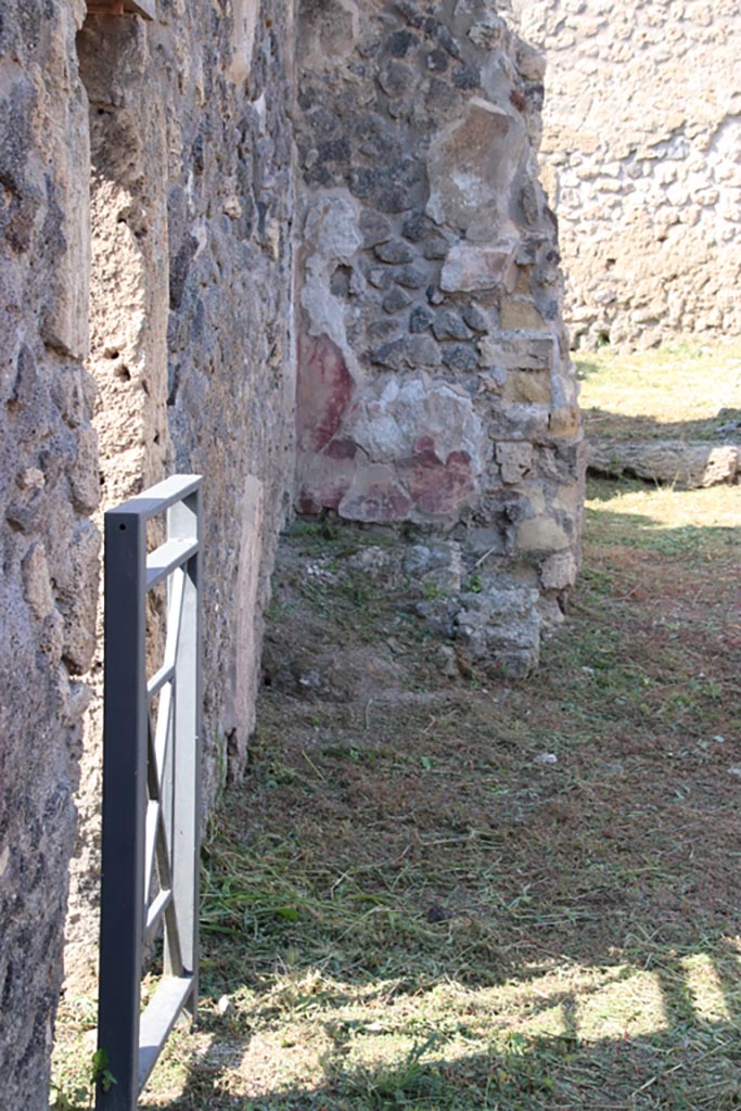 V.2.19 Pompeii. October 2022. 
Looking north along site of stairs along west wall, with doorway to V.2.17, on left.  
Photo courtesy of Klaus Heese.
