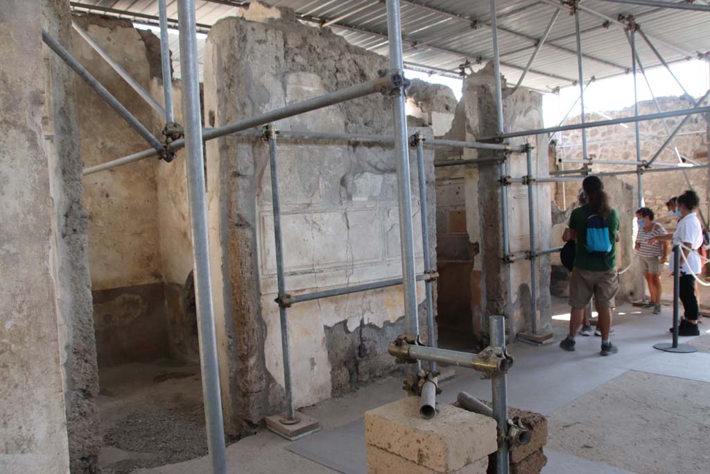 V.2.Pompeii. Casa di Orione. September 2021. 
Looking towards doorways to rooms A17, A11, and A13 on south side of atrium A12. Photo courtesy of Klaus Heese.
