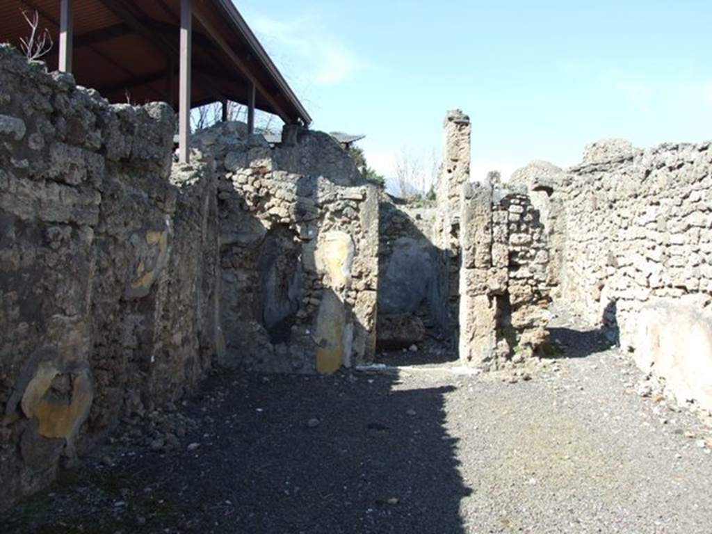 V.3.7 Pompeii.  March 2009.  Looking north across west side of atrium to Doorway to Triclinium, and passageway to the Garden.