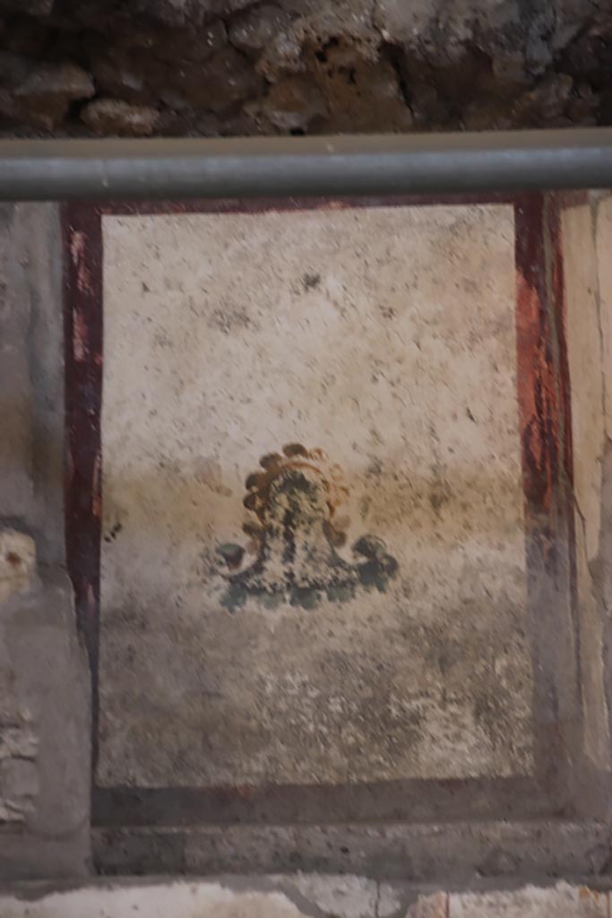 V.3 Pompeii. Casa del Giardino. October 2022. 
Room 7, detail of painted panel from south end of west wall. Photo courtesy of Klaus Heese. 
