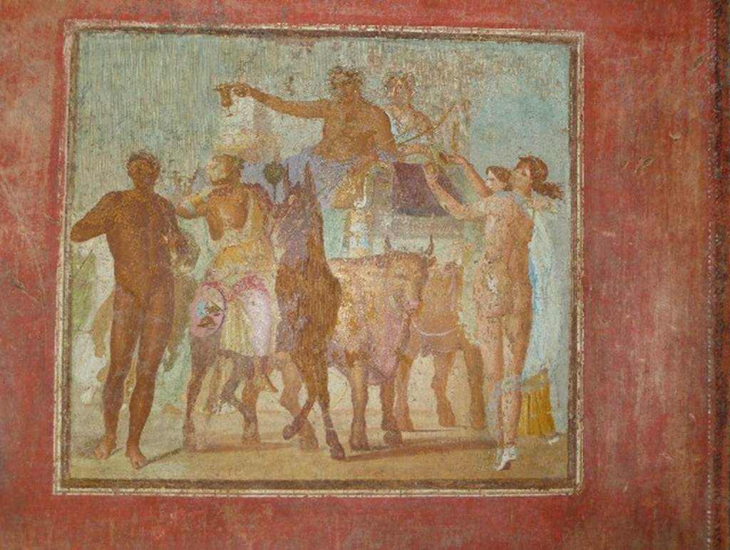 V.4.a Pompeii. July 2010. South wall of tablinum. Photo courtesy of Michael Binns. Wall painting of festival procession of Bacchus and Ariadne riding on a chariot drawn by two oxen.
