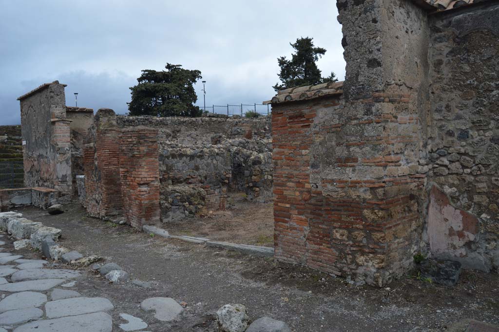 VI.1.4 Pompeii. March 2019. Looking north-east on Via Consolare to entrance doorway, in centre and towards VI.1.2, on left. 
Foto Taylor Lauritsen, ERC Grant 681269 DÉCOR.
