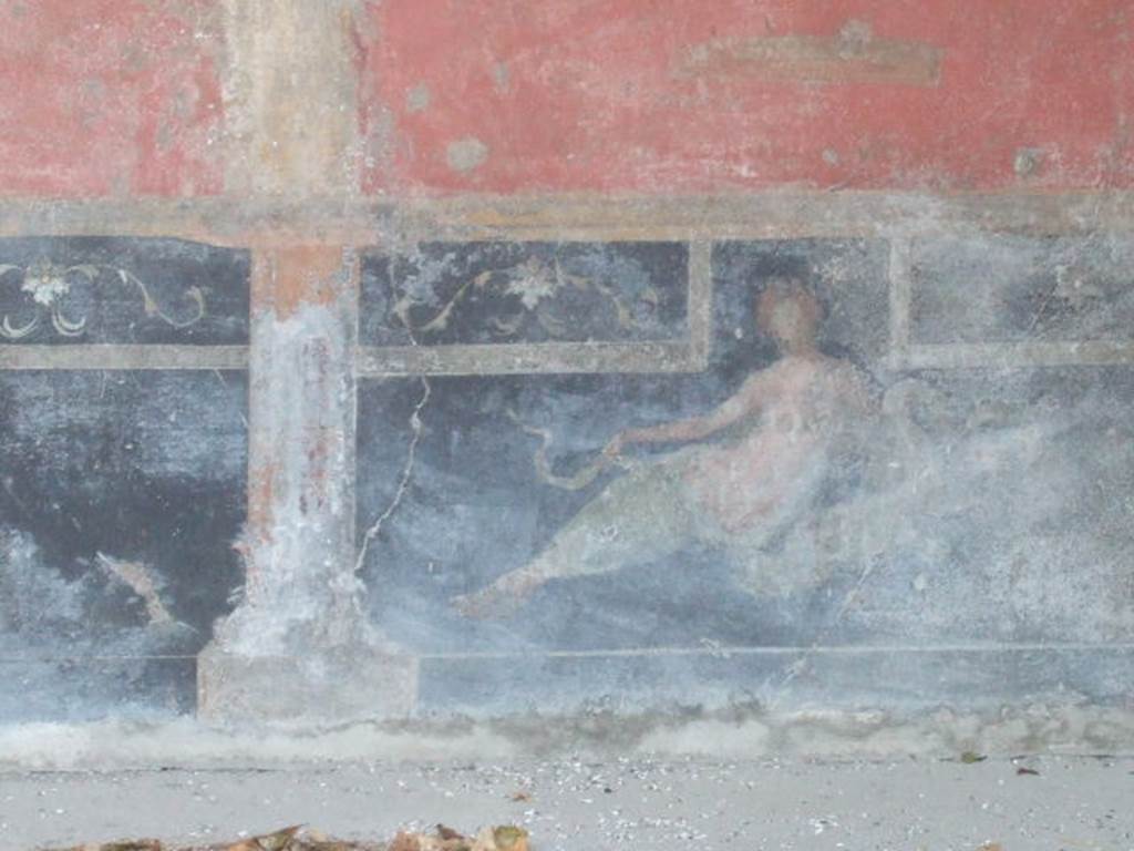VI.9.2 Pompeii. May 2006. Room 26, south end of east wall, painting of reclining figure.