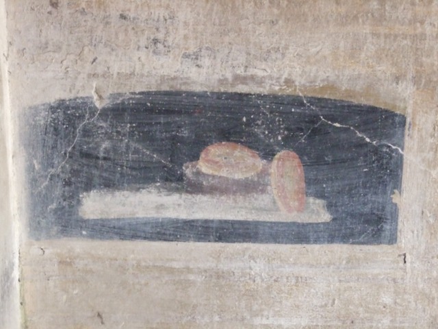 VI.9.2 Pompeii. December 2007. Room 27, painting of standing figure at east side of north wall, in north-east corner.