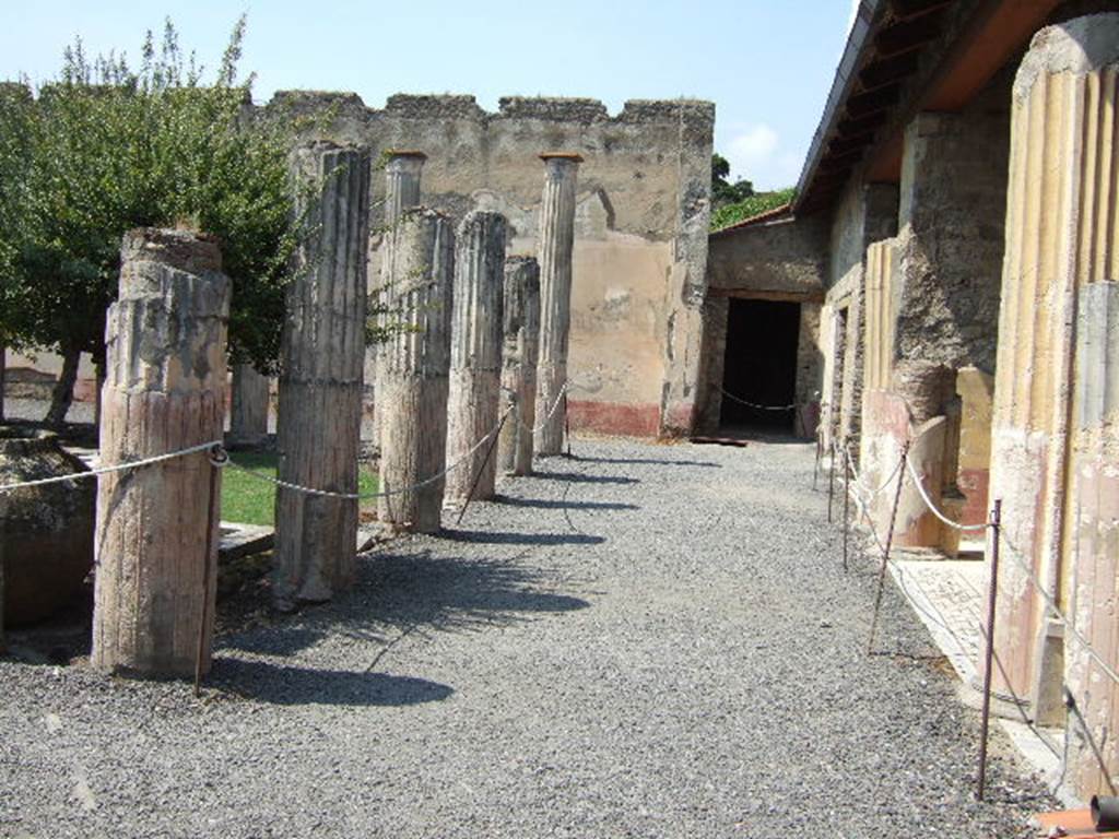 VI.9.2 Pompeii.  September 2004.  Peristyle.  East side.  Looking north towards room 28.
