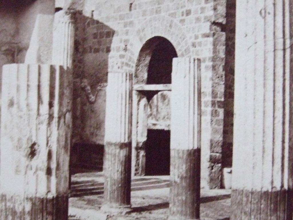 VI.9.2 Pompeii. Looking towards north-east corner of peristyle 16. The doorway to room 27 is in the centre, and the wall to the east of room 28, between the first and second columns, on left.  Old undated photograph, Courtesy of Society of Antiquaries. Fox Collection.
