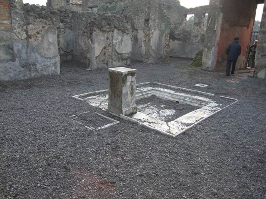 VI.9.2 Pompeii. December 2007. Room 2, atrium, impluvium 3 and pedestal 5, looking south-west towards room 10. In the left foreground behind pediment 5 and originally under the table 6 are two square marble recesses 7. According to Overbeck and Mau these were for cooling bottles. See Overbeck J., 1884. Pompeji in seinen Gebäuden, Alterthümen und Kunstwerken. Leipzig: Engelmann, p. 308.