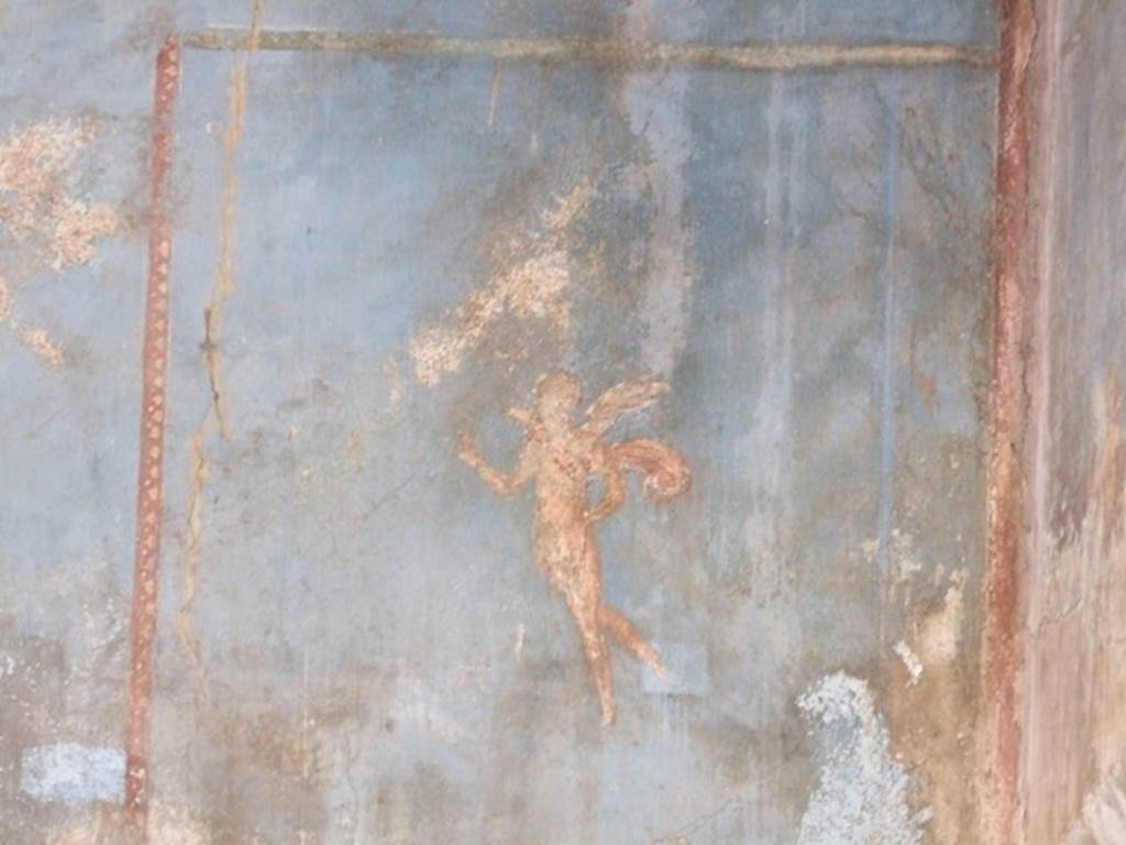 VI.9.2 Pompeii. December 2007. Room 29, painted flying cupid from panel at west end of south wall.