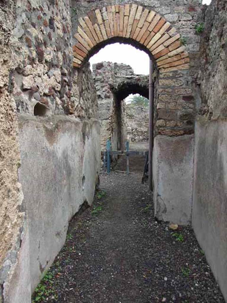 VI.9.2 Pompeii. May 2010. Room 32, corridor, looking east to services area.
