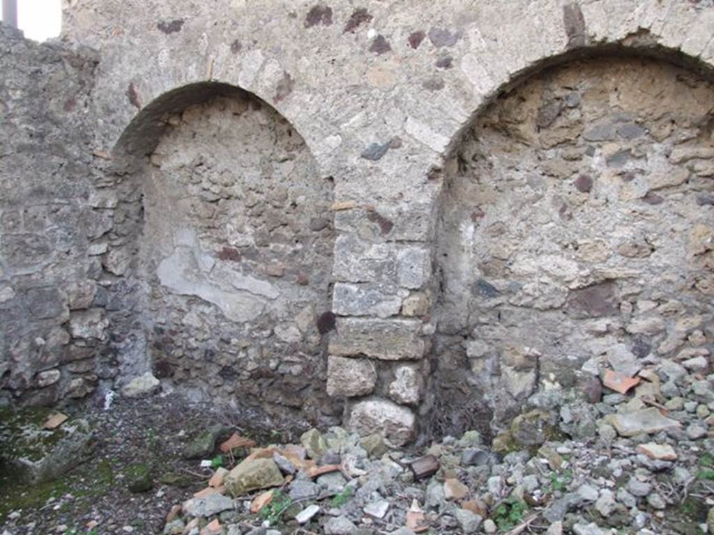 VI.9.2 Pompeii. December 2007. Room 38, kitchen. West wall. Area to the south of stone staircase on the east side of the house with arched recesses.