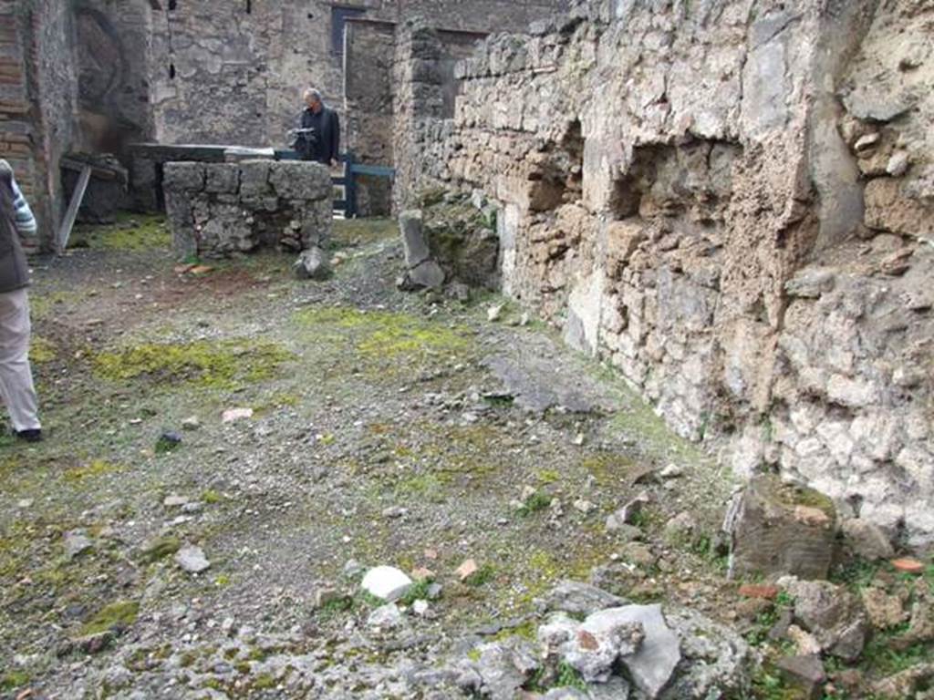 VI.10.4 Pompeii.  March 2009.  Looking along north wall of atrium area to two doors into rear of VI.10.3.